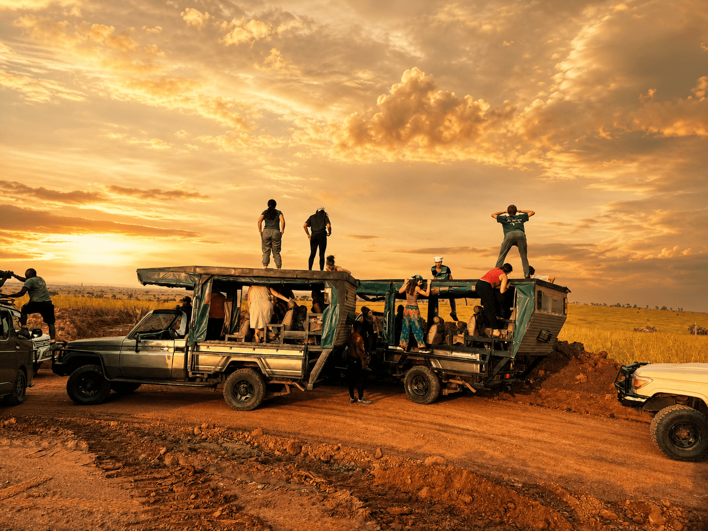 Safari vehicles on a game drive at Murchison Falls National Park, Uganda