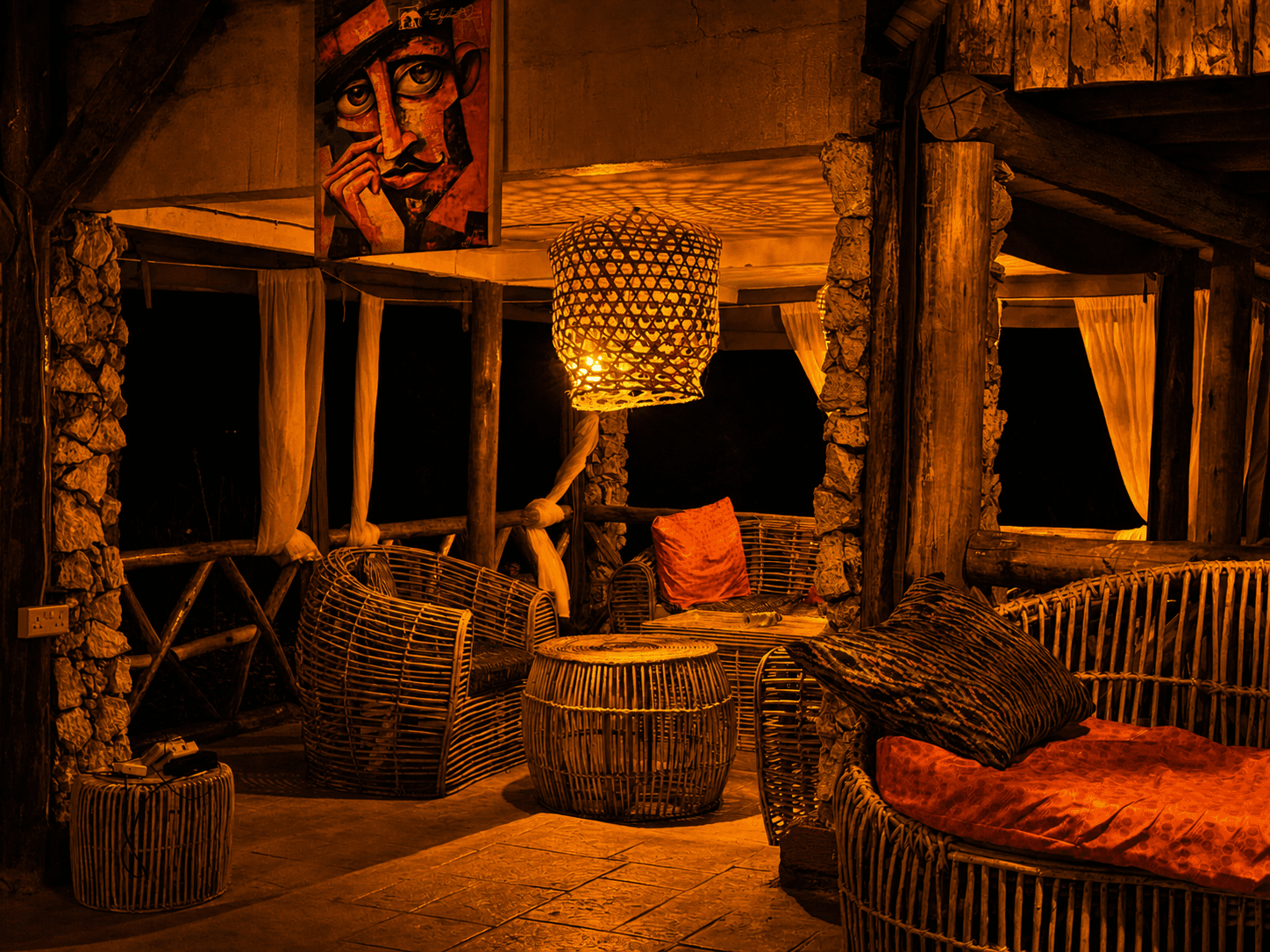 Outdoor bonfire dinner at The Elephant Oasis under a starry African sky, Murchison Falls Uganda